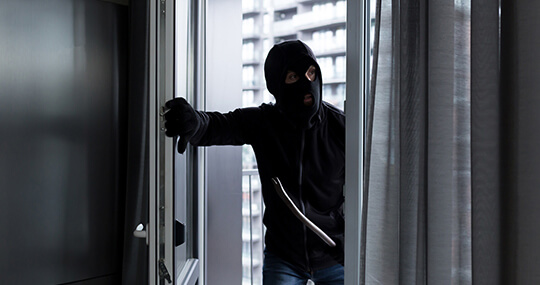 Man breaking into a building not secured with proper access control